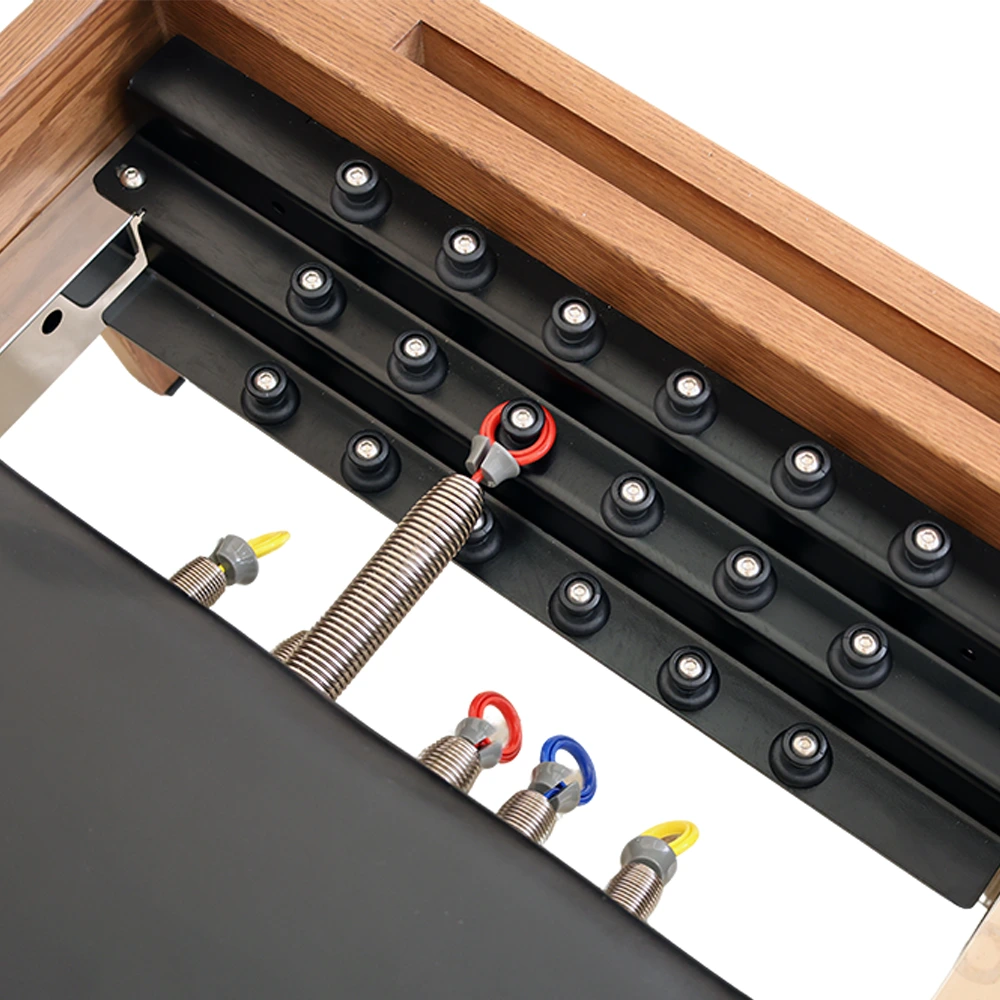 SourcePro Walnut Wood Reformer detail photo 4 — Solid Hardwood construction close-up